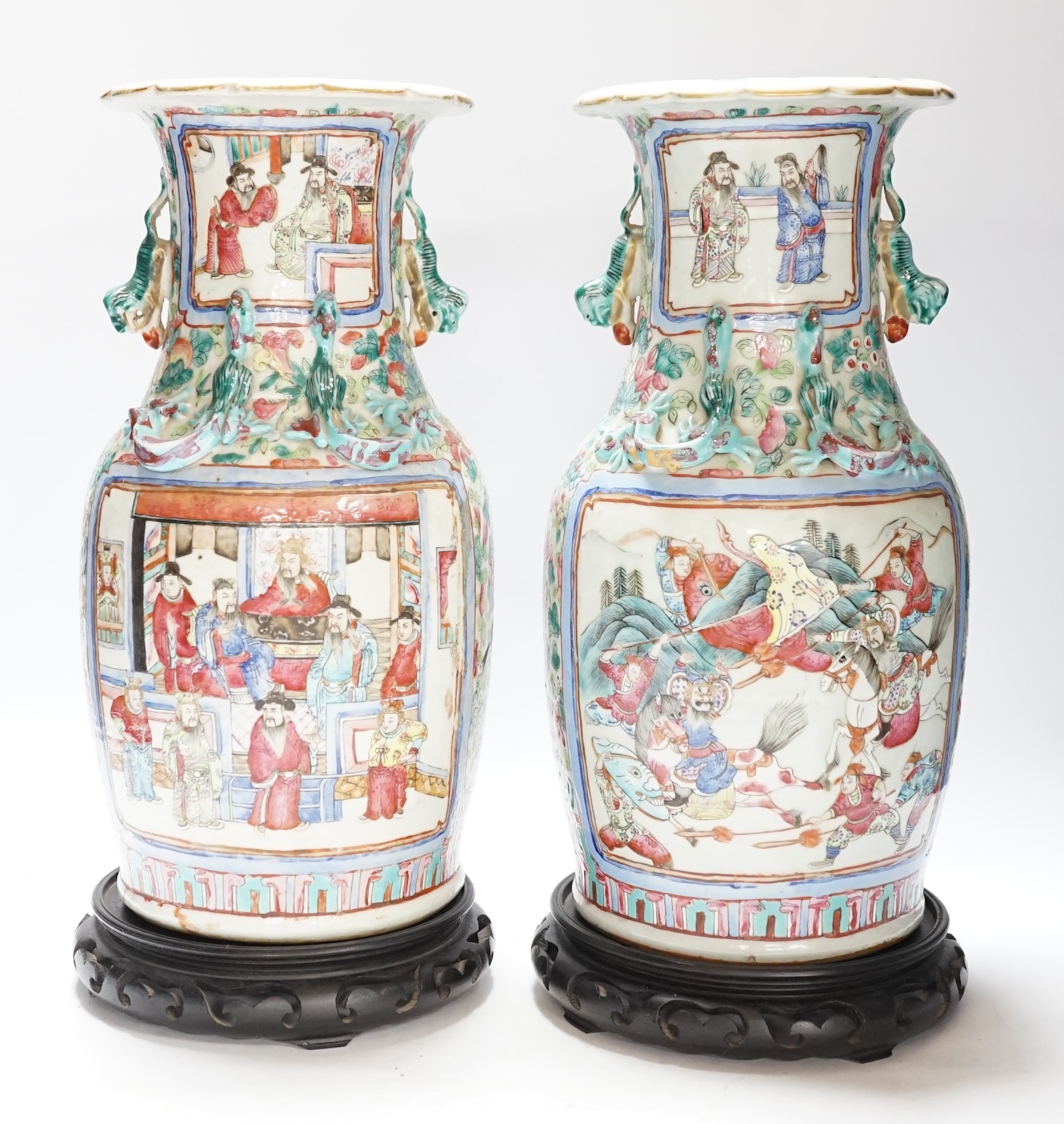 A pair 19th century Chinese famille rose ‘warriors’ baluster vases and stands, 39cm high including stands
